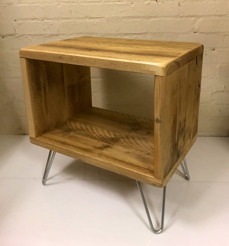 Rustic vinyl record storage unit constructed from reclaimed scaffold boards on zinc hairpin legs